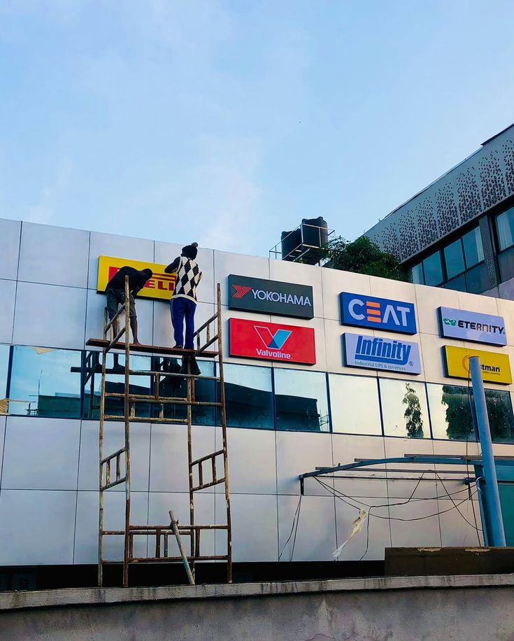 Brand panels being installed on a building facade
